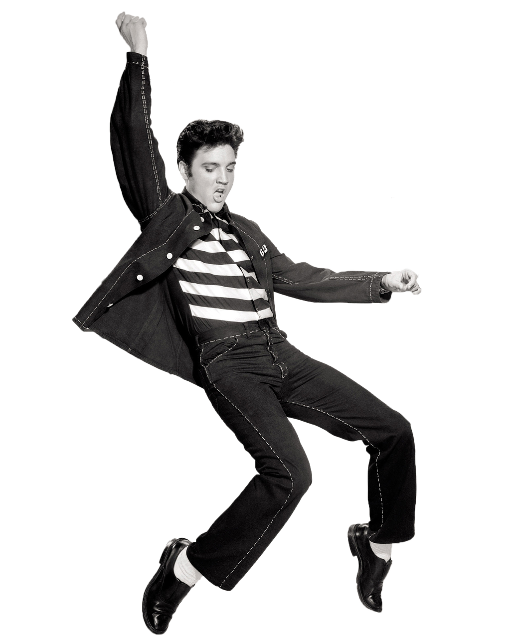 Elvis Presley mid-jump in a striped shirt and denim jacket